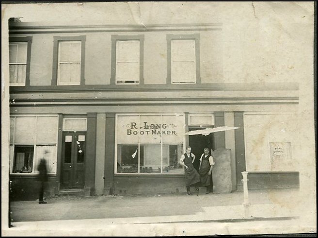 The double-fronted shop at 220-222 Timor St Warrnambool (now BIBA Hairdressing) as it was in 1919 when Robert Long, right, ran his bootmaking business. Image courtesy Helen Thomson.
