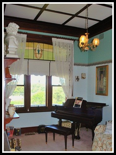 The Masters keep a watchful eye in the music room which reflects Sue's passion for history, antiques and art.